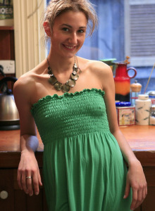 Tall brunette Gali in green dress and warm stockings