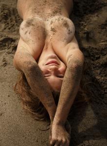 Amateur teen Tatiana Penskaya covers her perfect boobs with sand on the beach