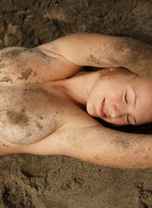 Amateur teen Tatiana Penskaya covers her perfect boobs with sand on the beach