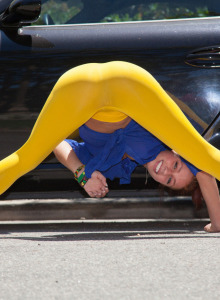 Petite Victoria Lynn is outside in yellow spandex