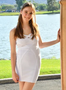 Sexy fresh young Hazel is outdoor in cute fashion white dress